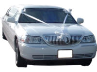 Cars for Stars (Brighton) - Wedding Limo. White Lincoln stretched wedding limousine with white ribbons